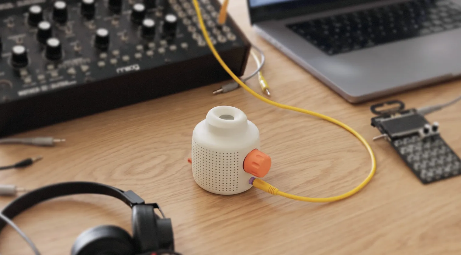 mur mur device on a desk connected to Moog synthesizers and other music gear